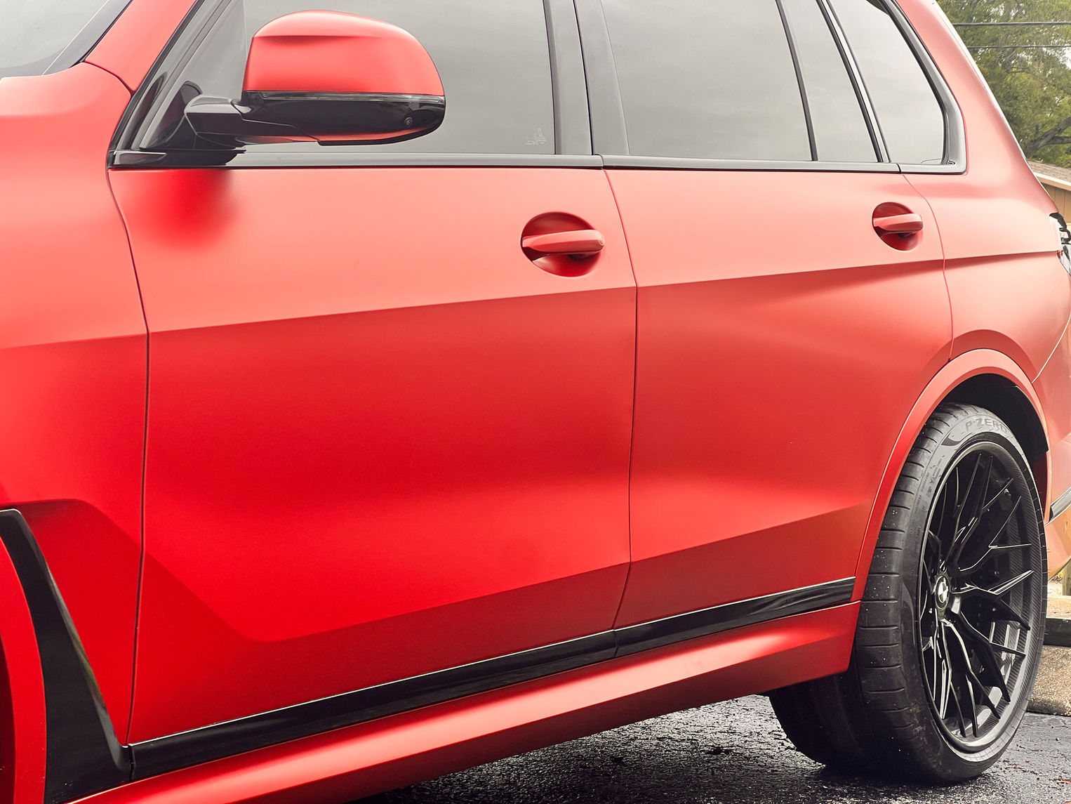 Red BMW SUV with custom wrap
